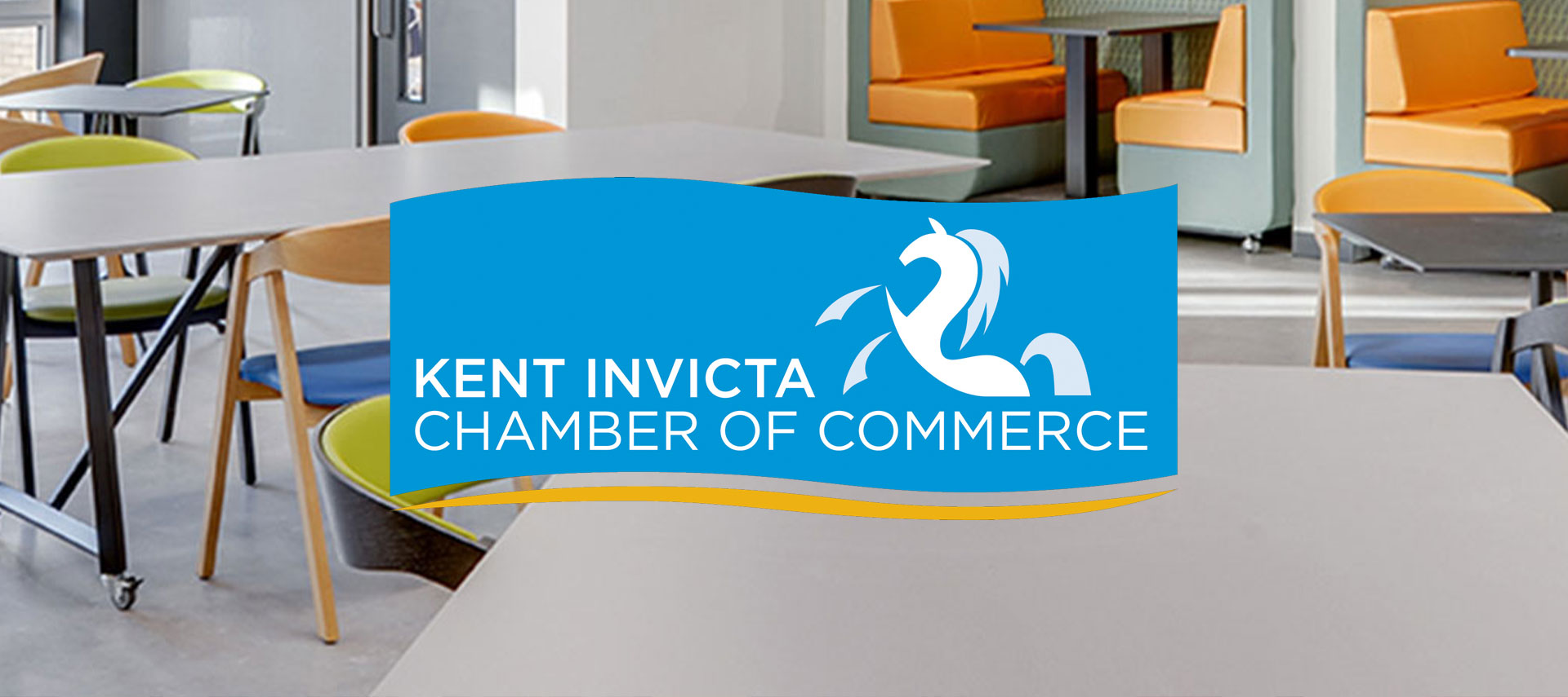Kent Invicta Chamber of Commerce logo in a modern commercial interior setting
