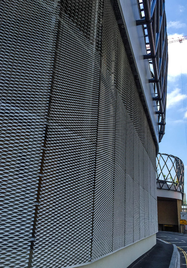 Vertical view of expanded metal mesh cladding on Hallsville Quarter building exterior