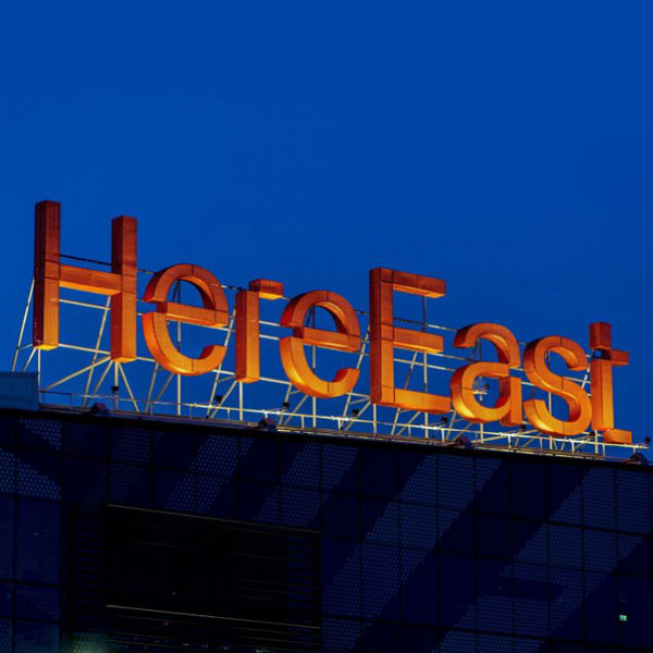 HereEastSign-Expanded-SQUARE Here East signage on glass façade with integrated expanded metal mesh cladding