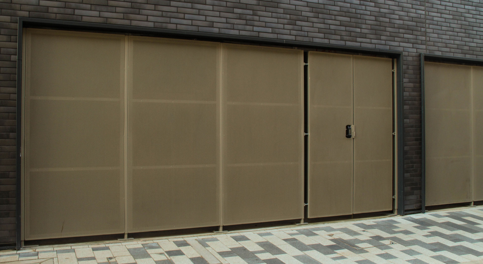 Perforated metal sheet façade panels at Stevenage Town Centre exterior.