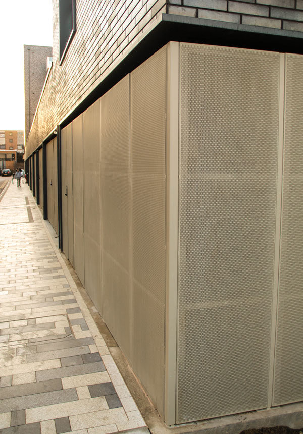 Long elevation of perforated metal sheet façade at Stevenage Town Centre.