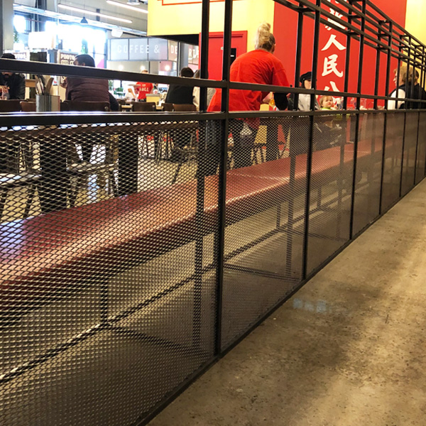 Expanded metal mesh railing detail in public space
