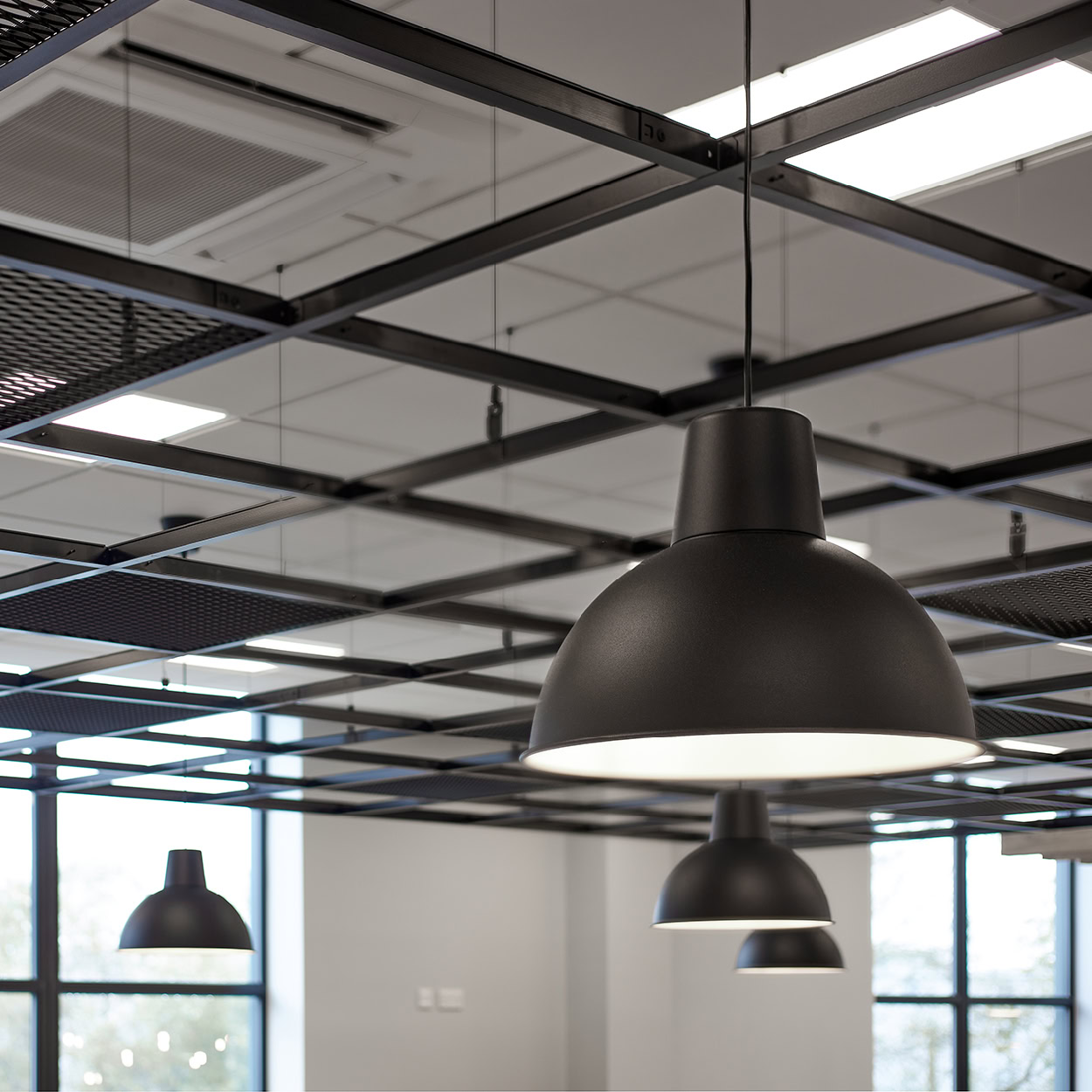 Close-up of the expanded mesh AC300 ceiling system at 1 cavendish Place.