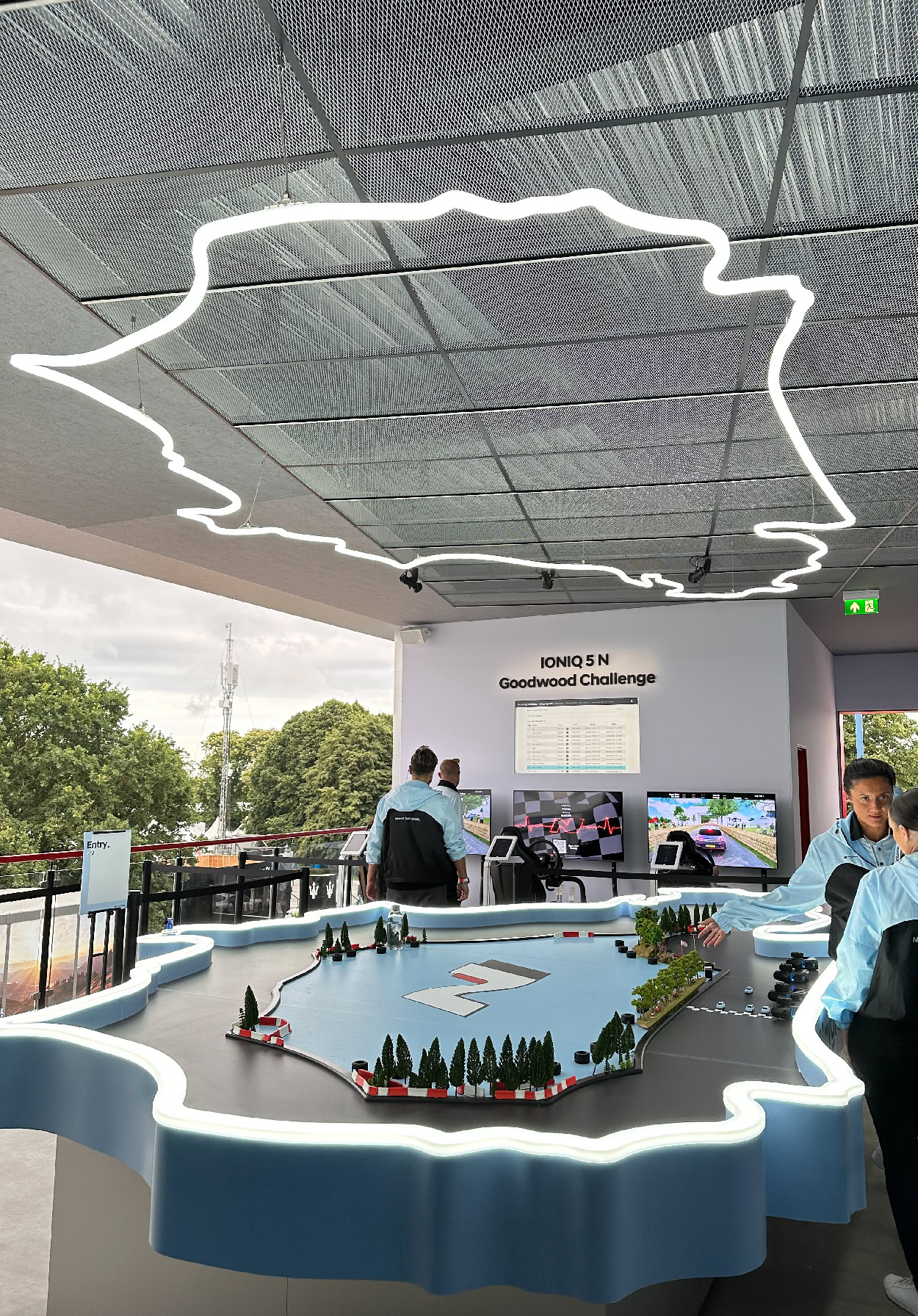 White grid ceiling system with neon outline