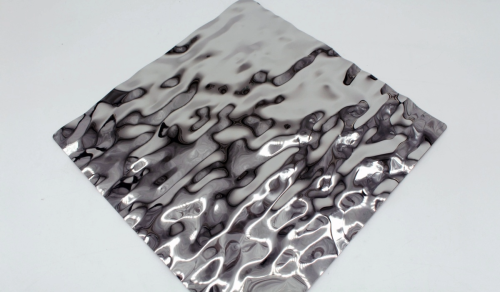 A large square sample of a water ripple embossed sheet in a super mirror finish.