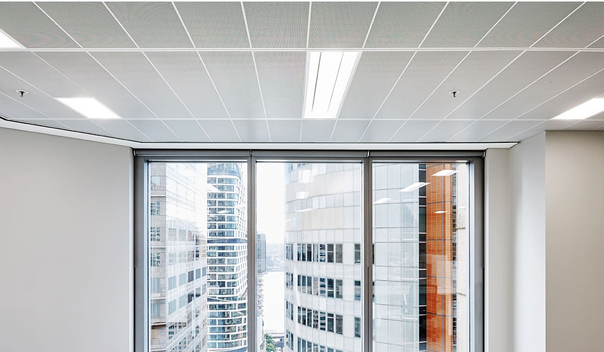 A white metal mesh ceiling of the AC700