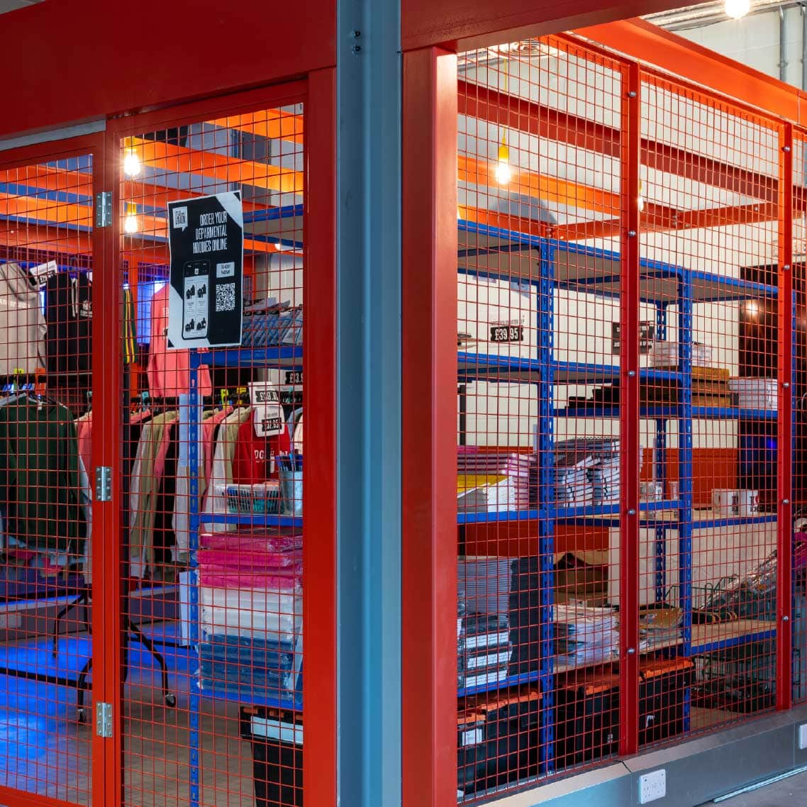Red decorative mesh room. filled with storage and clothes. nicely on display.